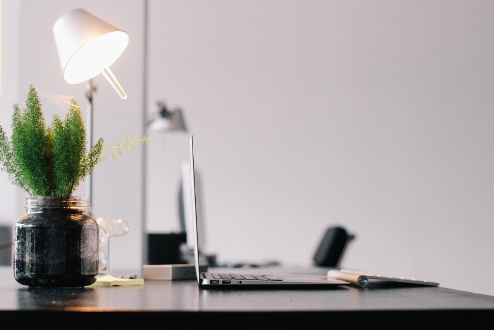 computer on desk with lamp