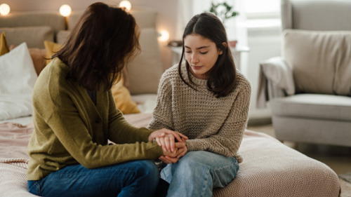 anxious teen girl talking to her mom 