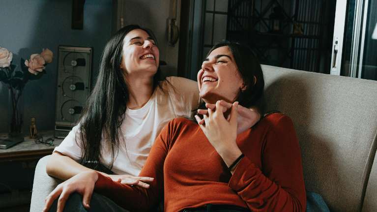 daughter and mom hugging on a couch during therapy in federal way