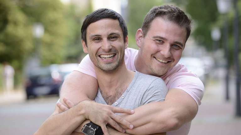 a male couple hugging in washington state