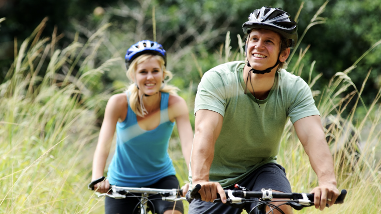 man and woman riding on bikes in federal way park