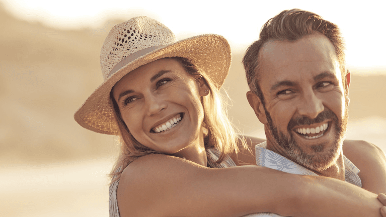 woman hugging husband's shoulders