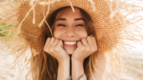 woman in hat smiling